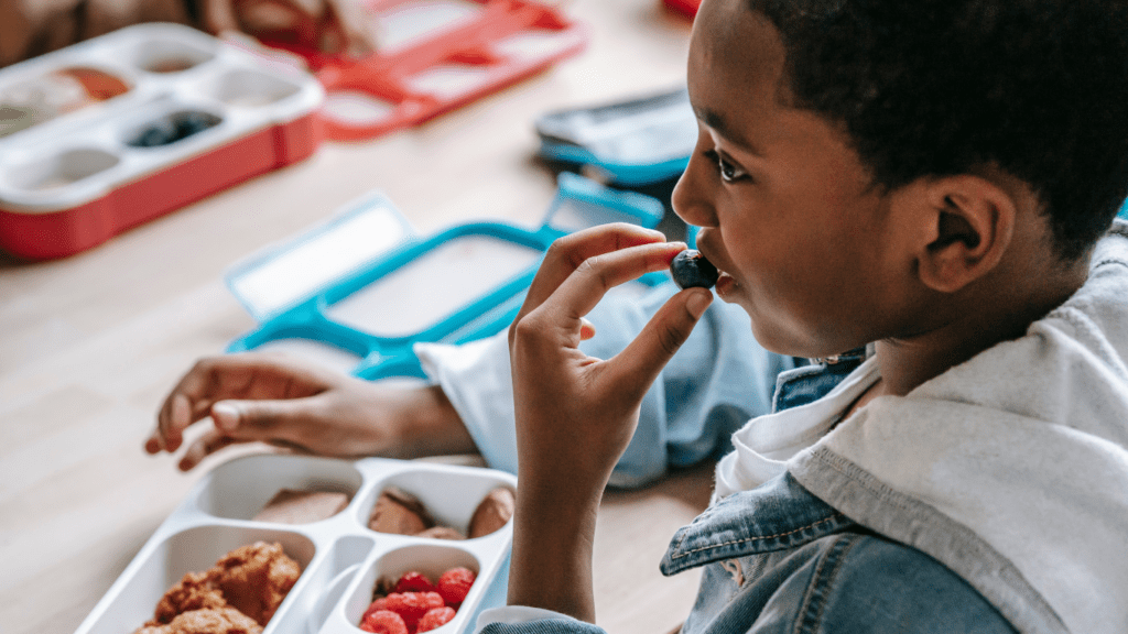 a person eating his lunch in a school cafeteria