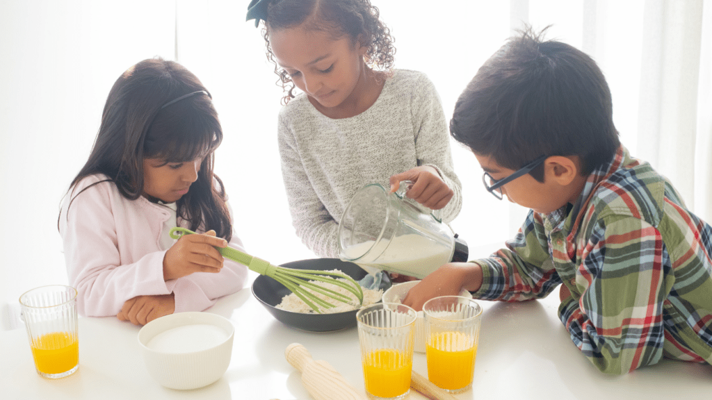 children eating eggs and orange juice