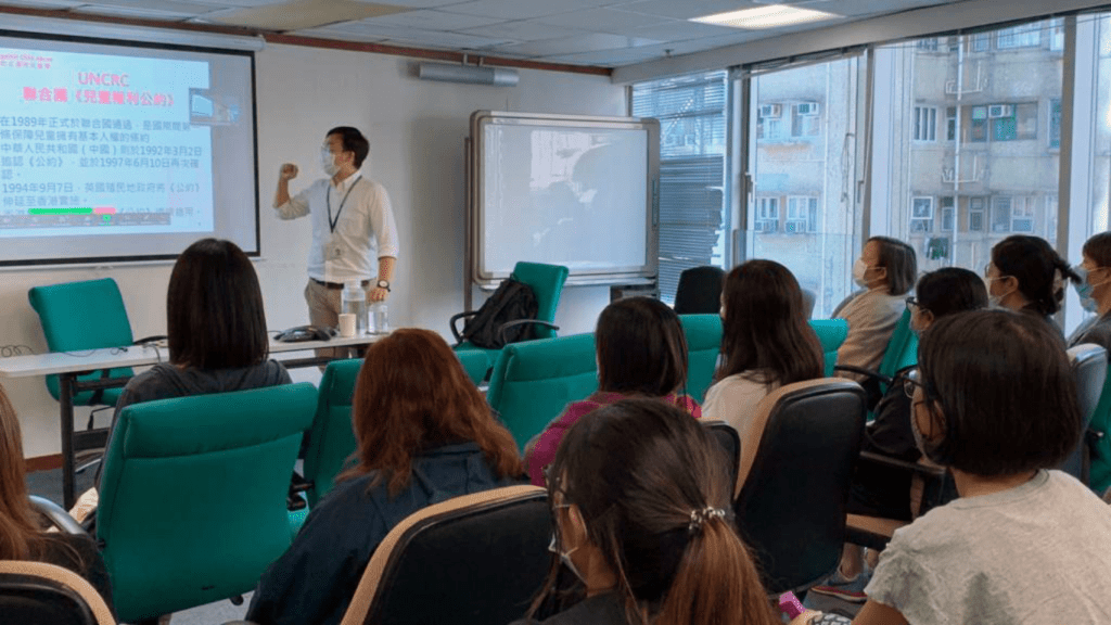 a person giving a presentation in front of students