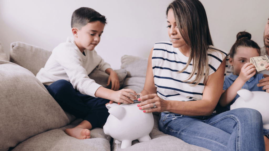 a family is putting money into a piggy bank