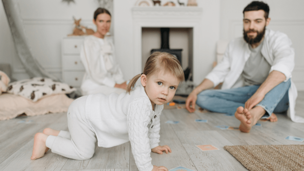 a family is sitting on the floor