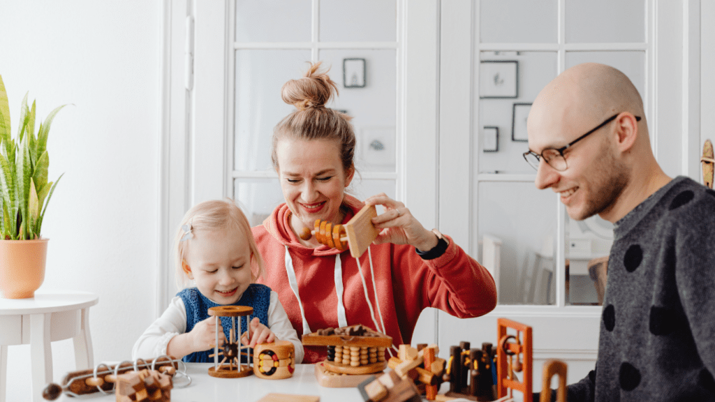 a parent and child playing with toys