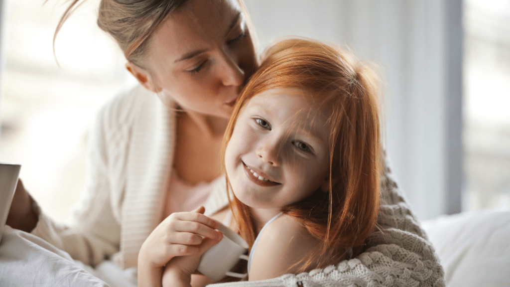 a parent and child sitting at a table