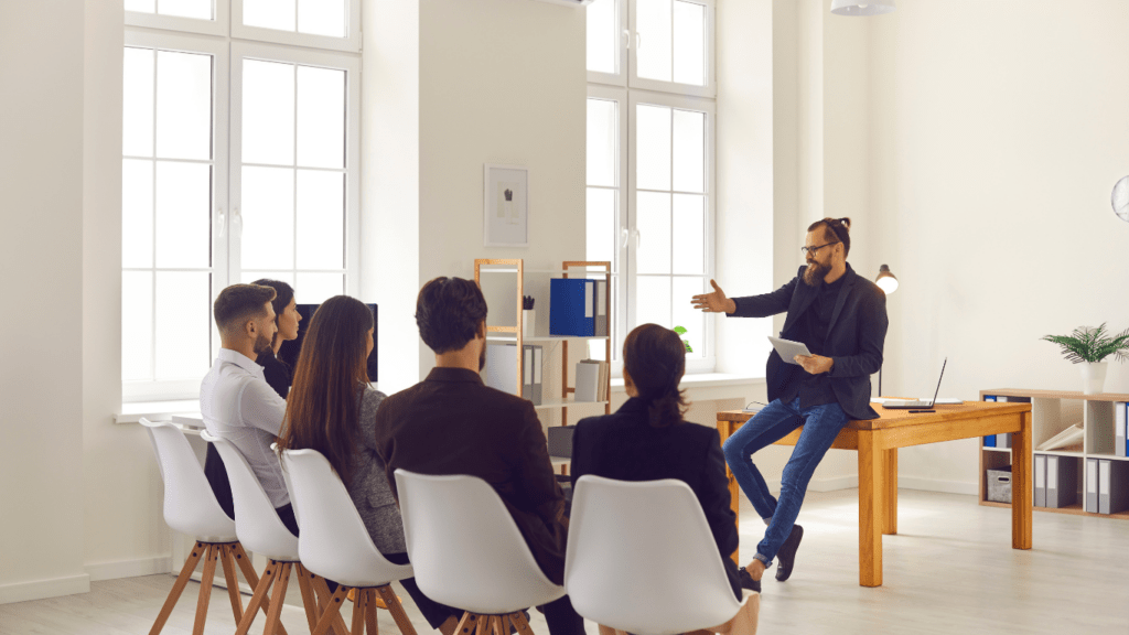 a person giving a presentation in front of students