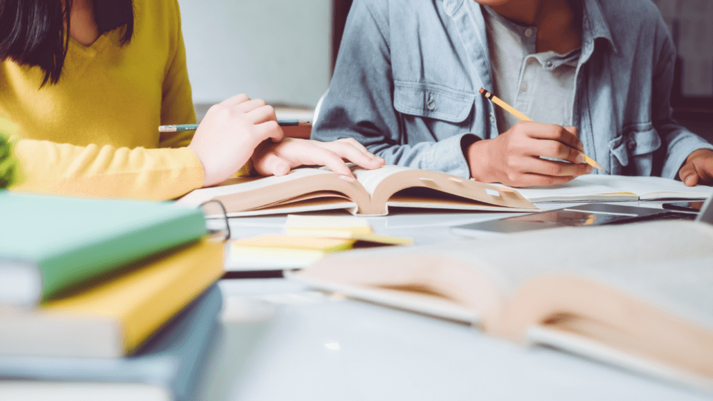 a teacher helping students with their financial homework