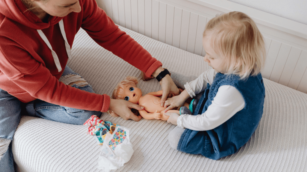 a toddler playing with toys on a couch