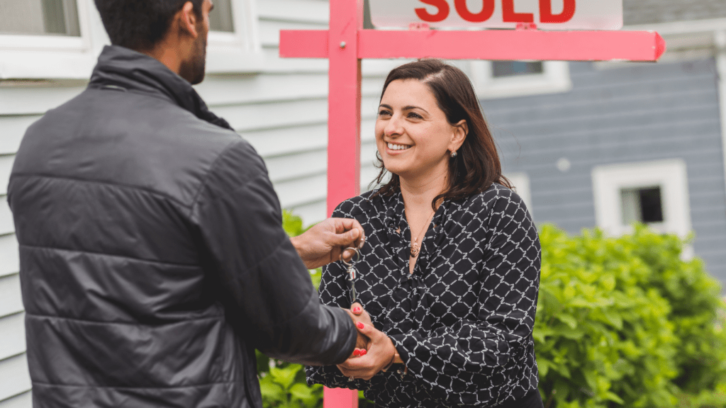 buyer and seller shake hands in real estate transaction