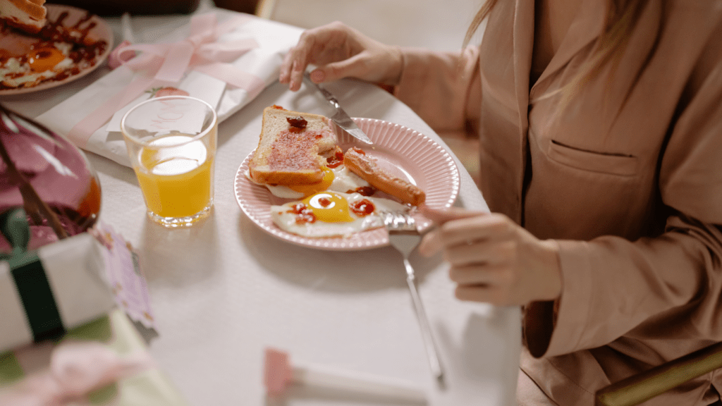 children eating eggs and orange juice