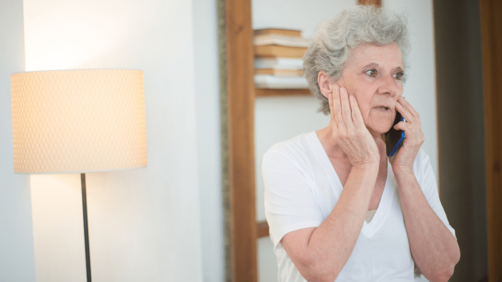 elderly woman calling emergency phone number