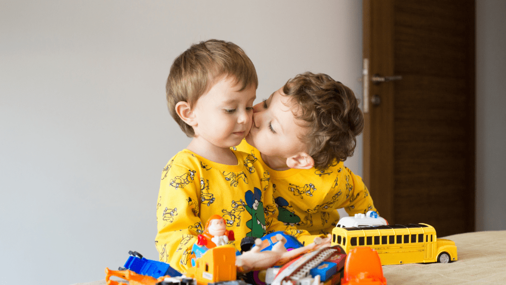 two children playing with toys in the living room