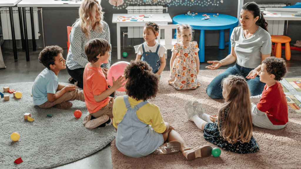 children sitting on the floor in a classroom